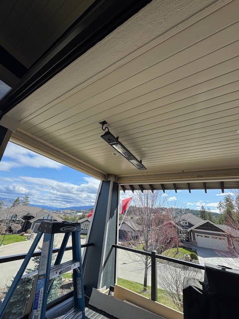 Exterior residential heat pump installation overlooking the Okanagan Valley