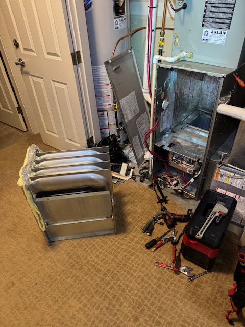 Aslan technician servicing a residential gas furnace in Vernon, BC